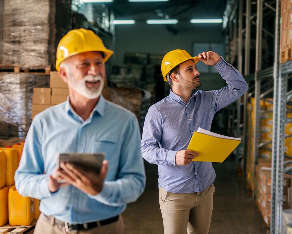 a son helps his father perform an inventory check for the family business