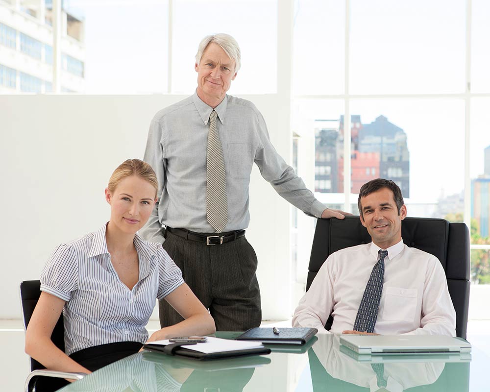 A father meets with his children in a conference room of the family enterprise